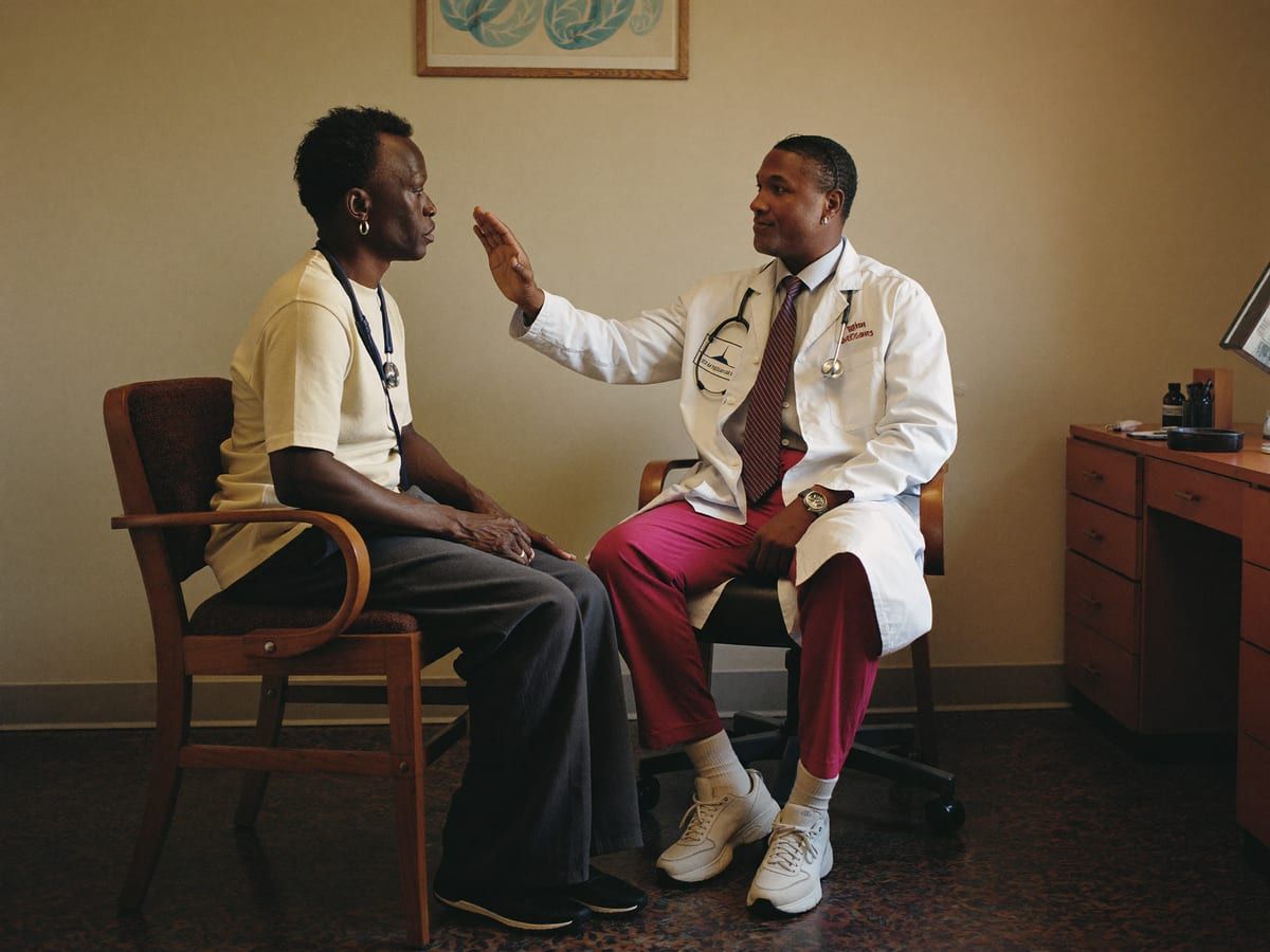 Doctor in consultation with an older patient
